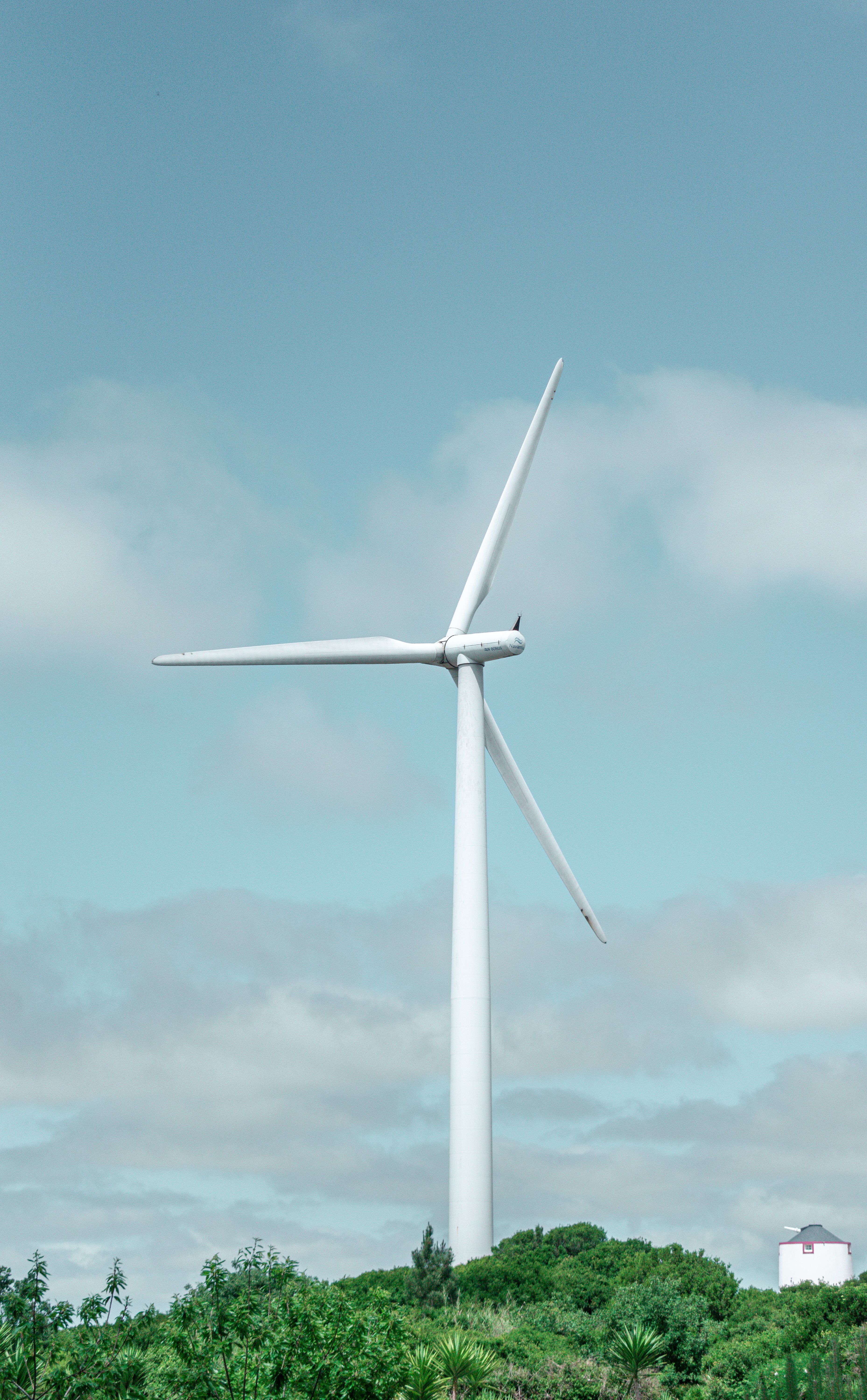 Wind Turbine Against Clear Blue Sky · Free Stock Photo