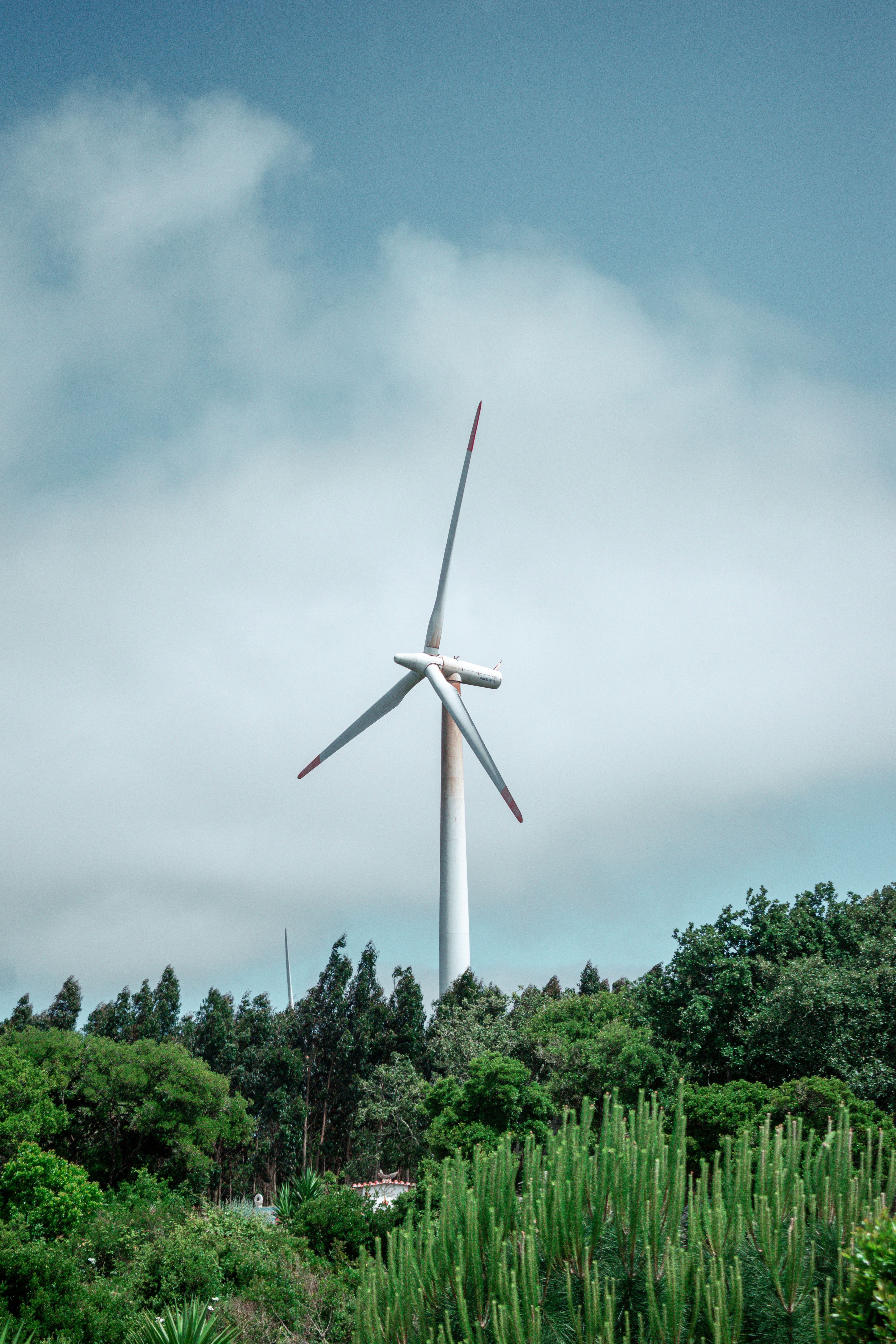 Majestic Wind Turbine Against Blue Sky · Free Stock Photo