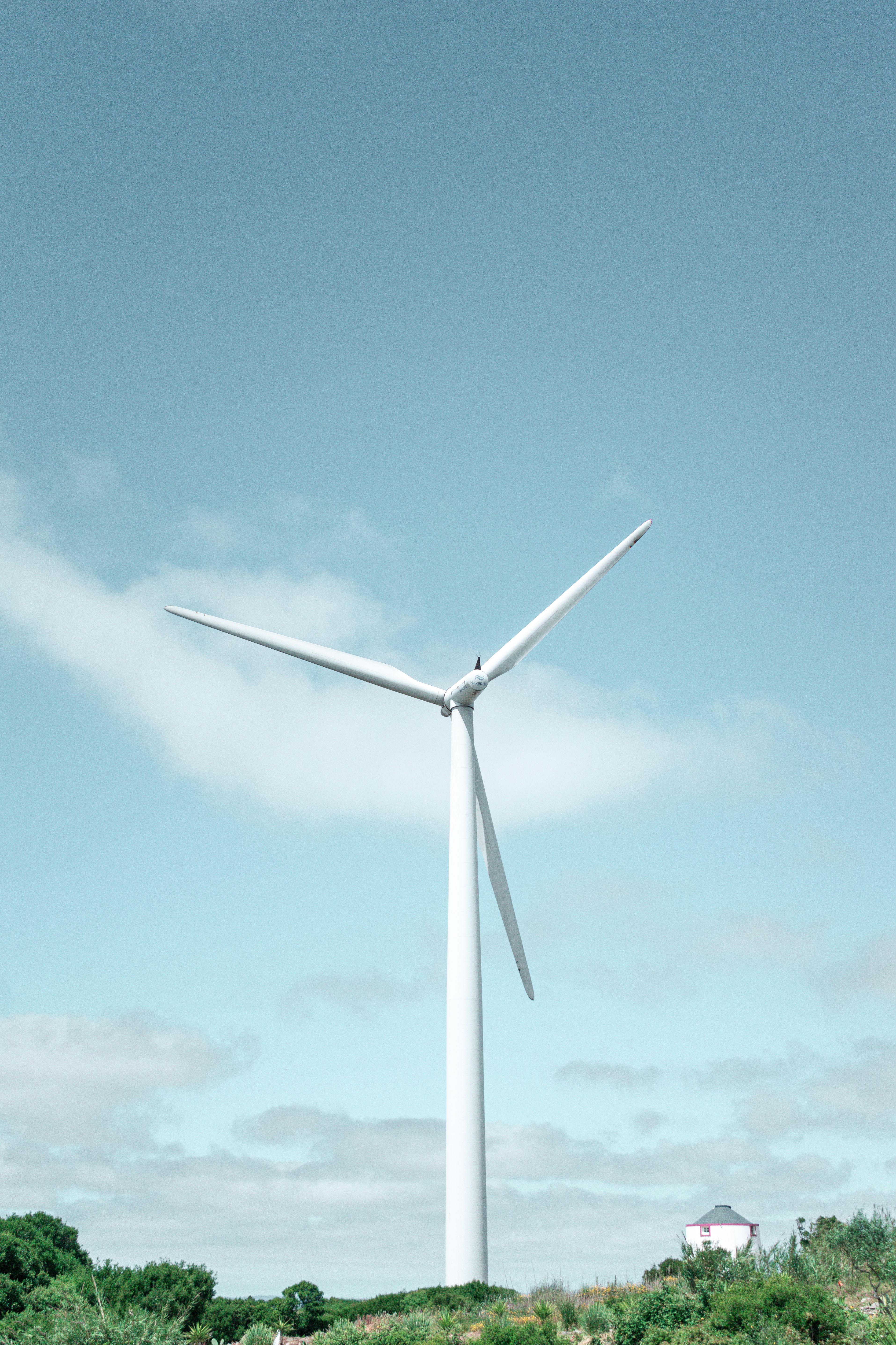 Majestic Wind Turbine in Clear Blue Sky Landscape · Free Stock Photo