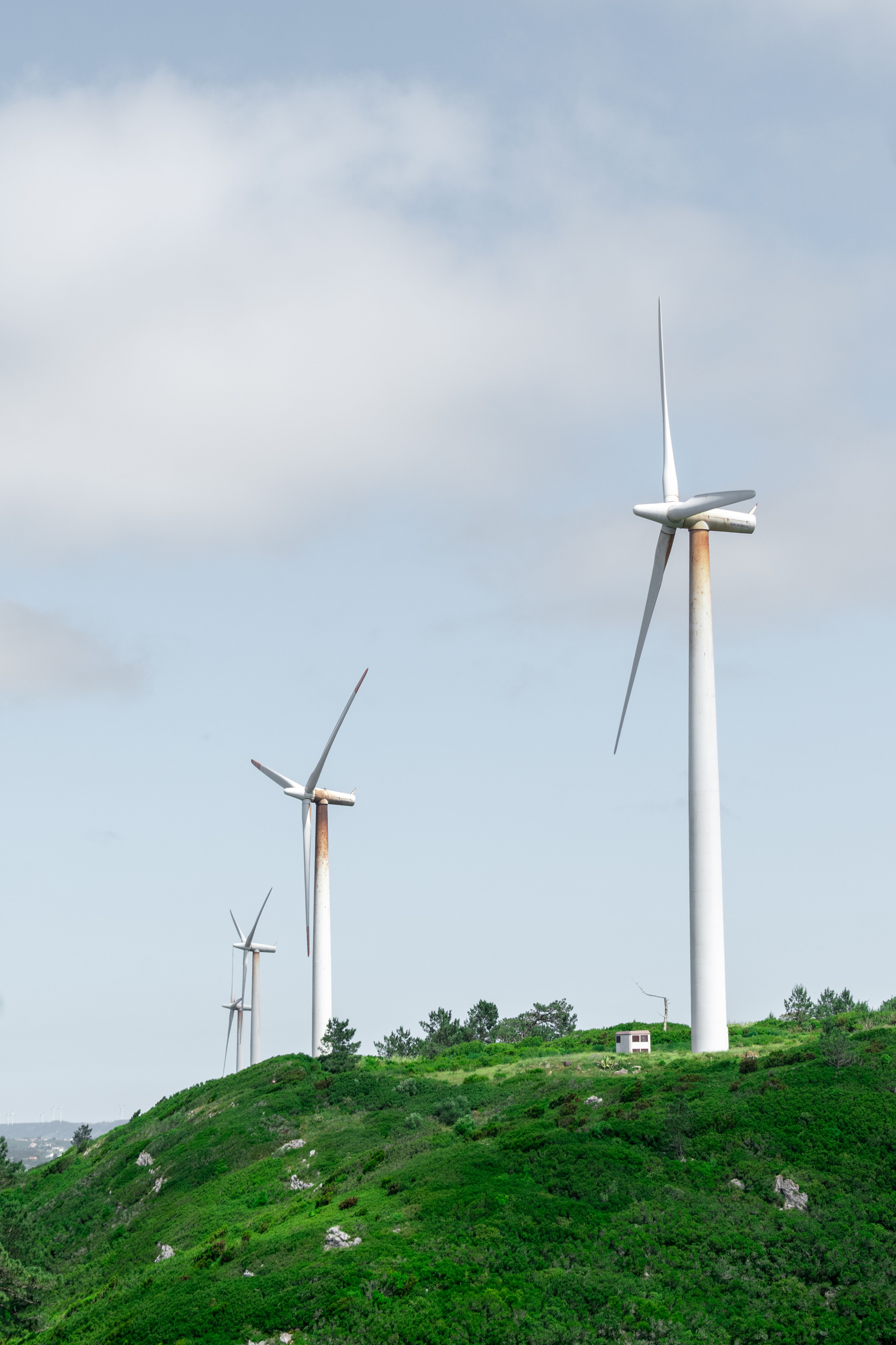 Photo Of Wind Turbines Under Cloudy Sky · Free Stock Photo