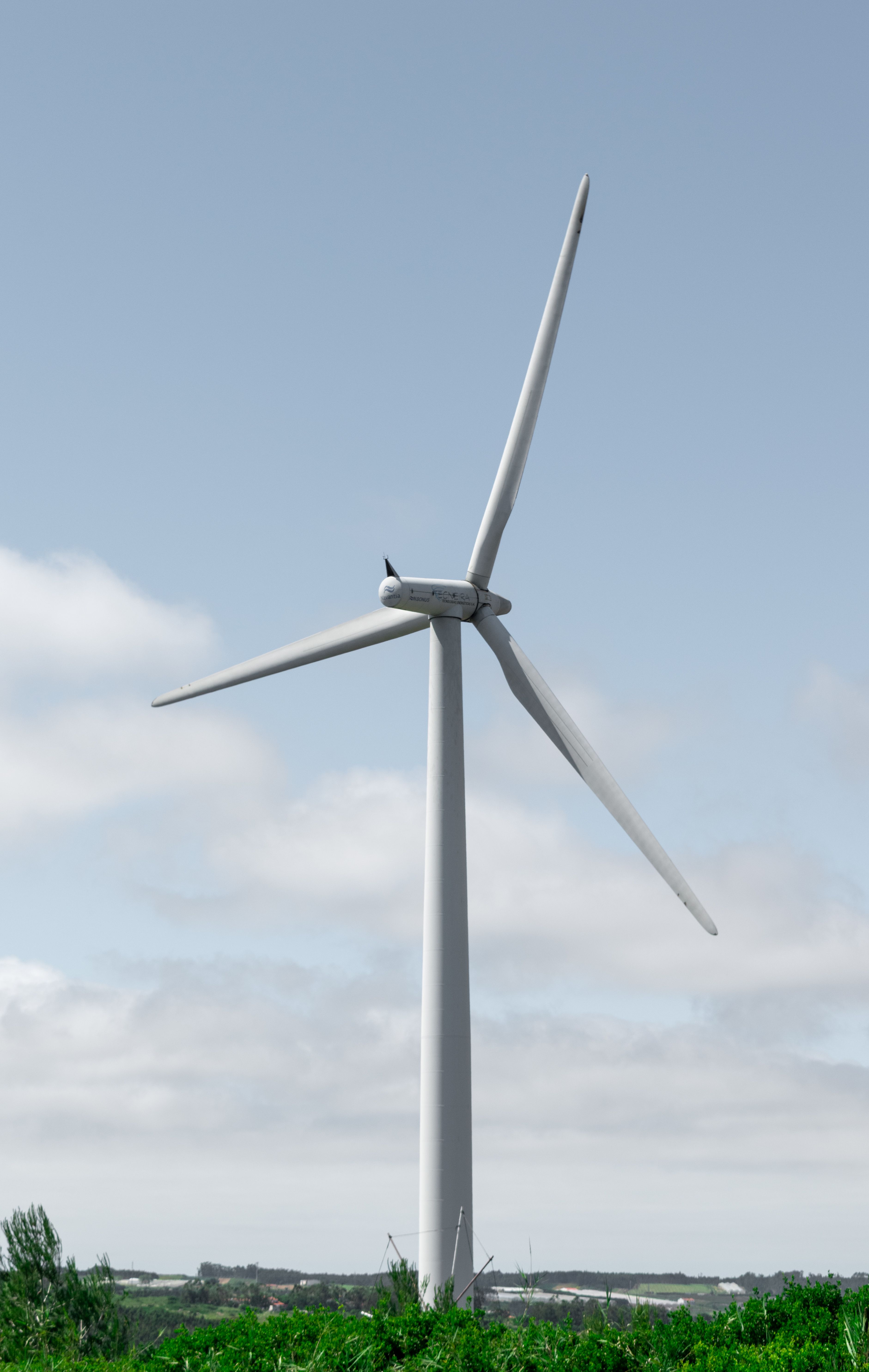 Wind Turbine Against Clear Blue Sky · Free Stock Photo
