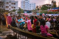 Children enjoying a boat ride during a colorful festival in Chittagong, Bangladesh.