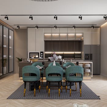 Sleek and modern kitchen with dining area featuring teal chairs and minimalistic design.