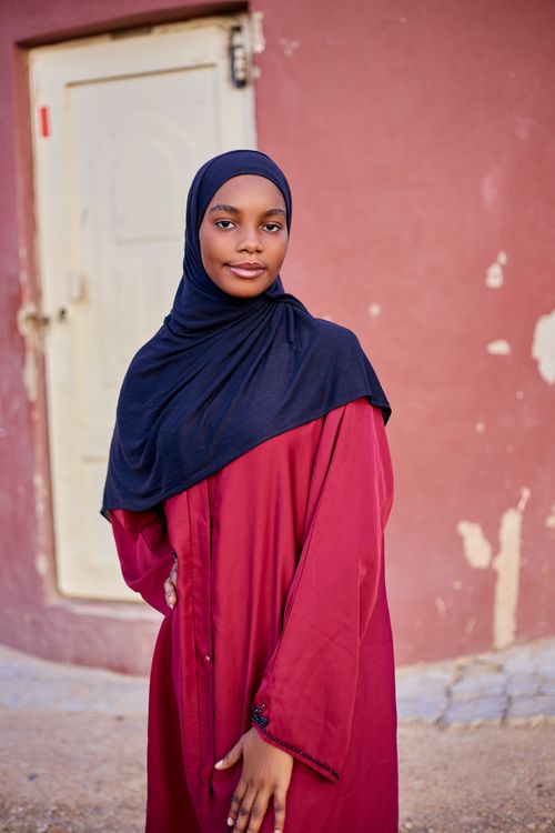 Portrait of a Young Woman in Traditional Attire · Free Stock Photo