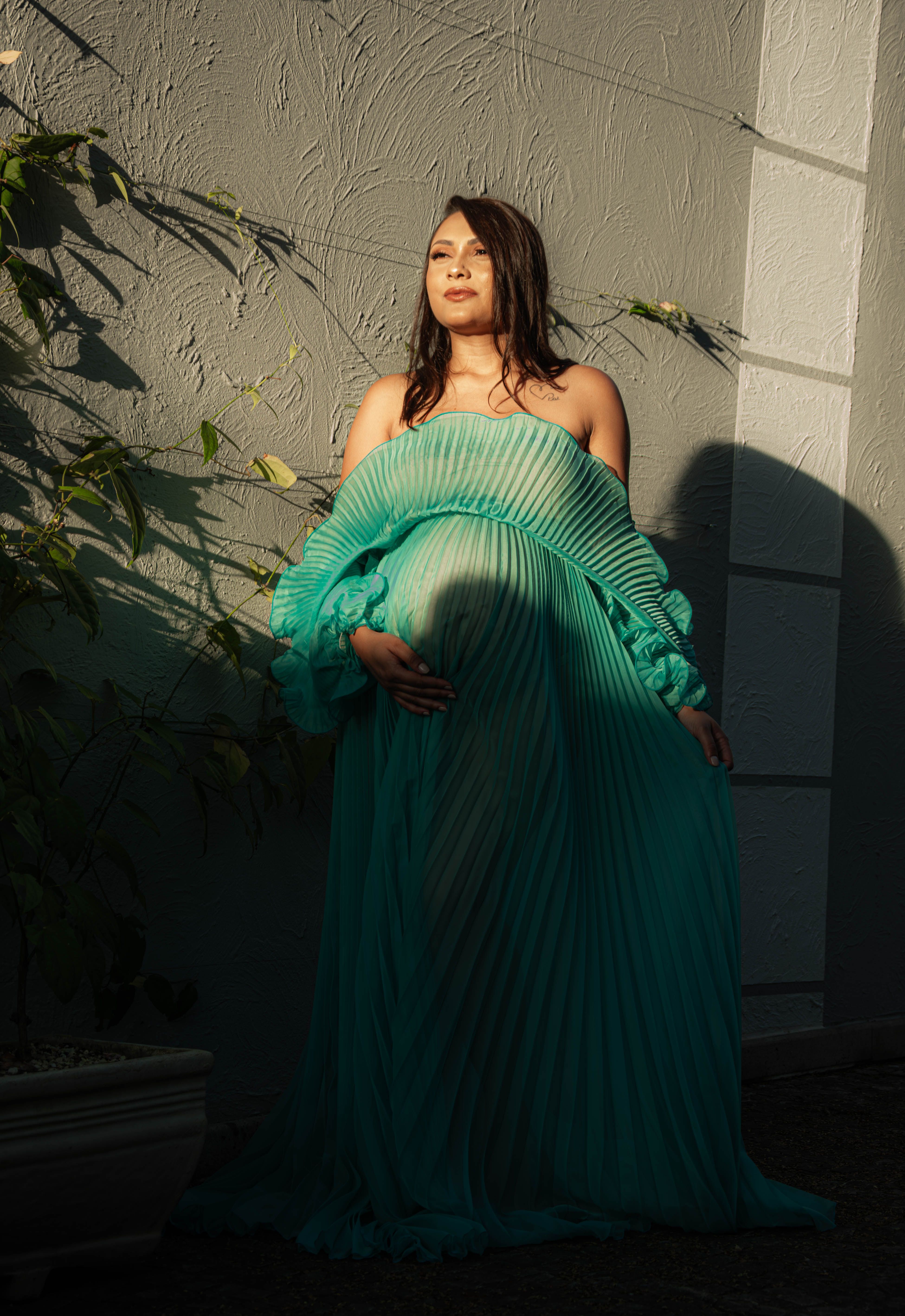 Pregnant Woman in Elegant Green Dress Outdoors · Free Stock Photo