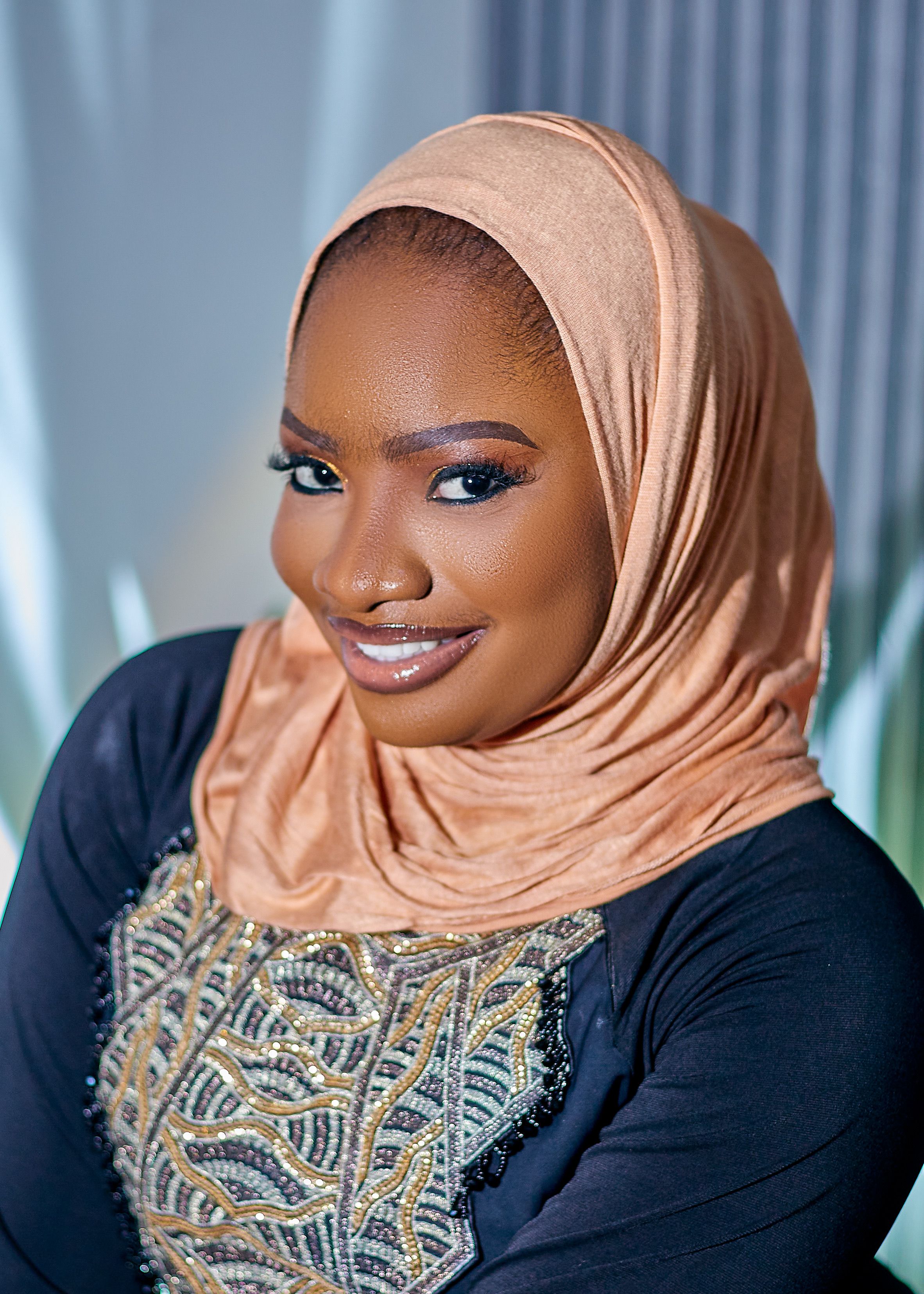 Portrait of a Smiling Woman in a Hijab · Free Stock Photo