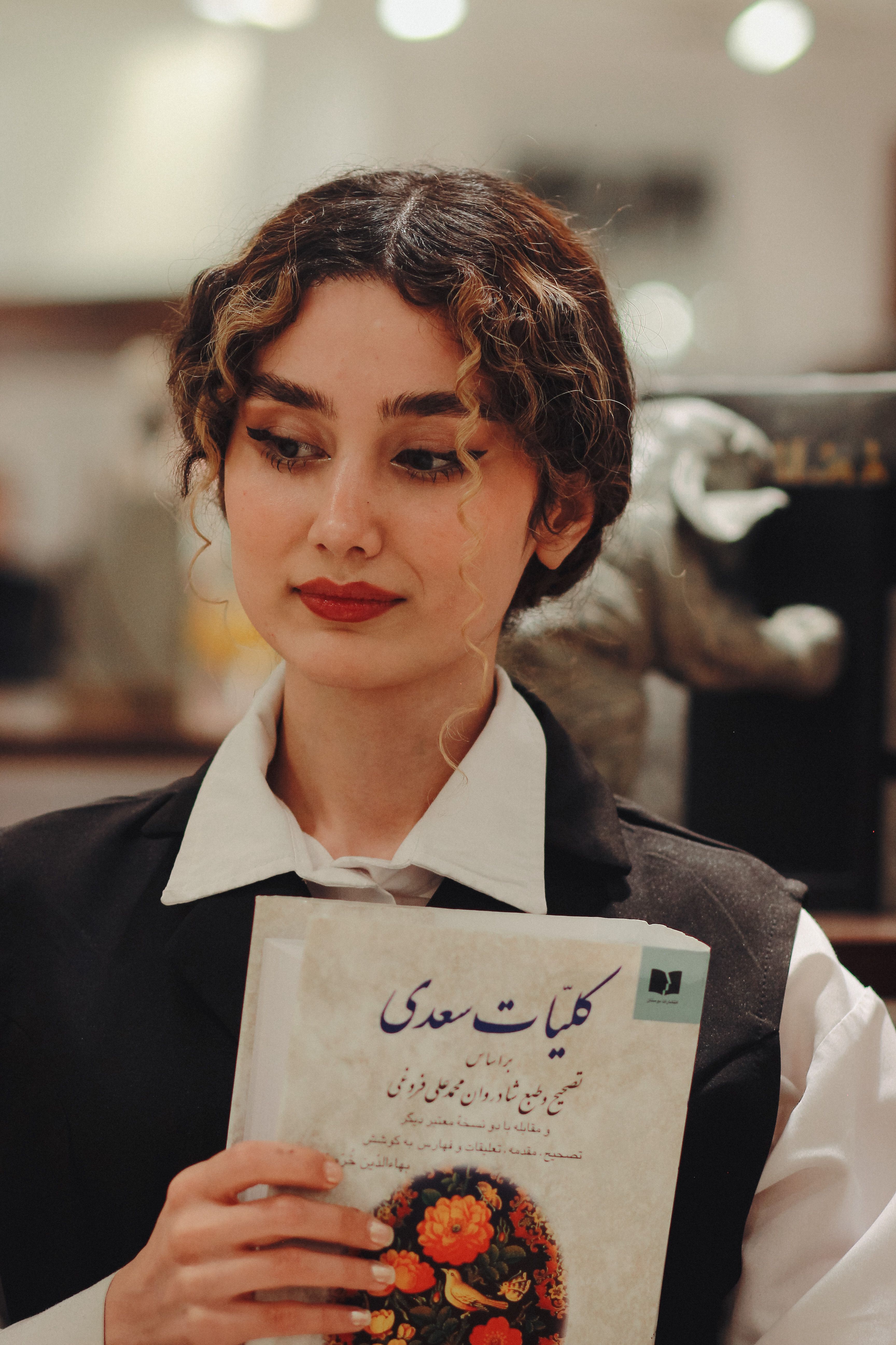 Artistic Portrait of Woman Holding Persian Book