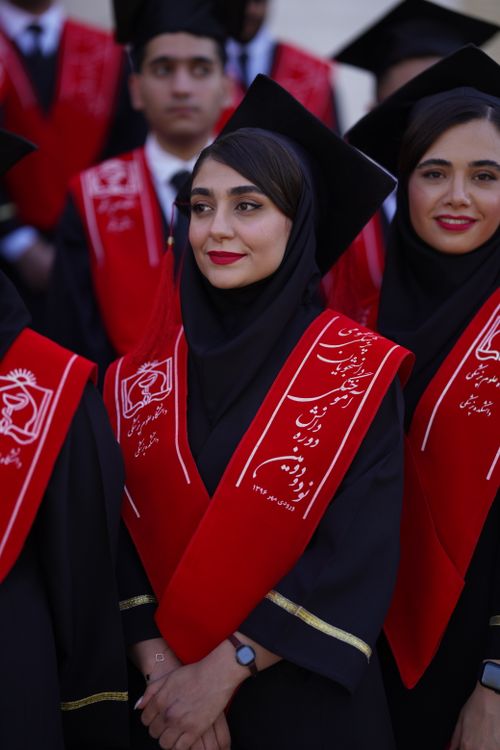 Free A group of young female graduates in caps and gowns celebrate their achievement in Iran. Stock Photo