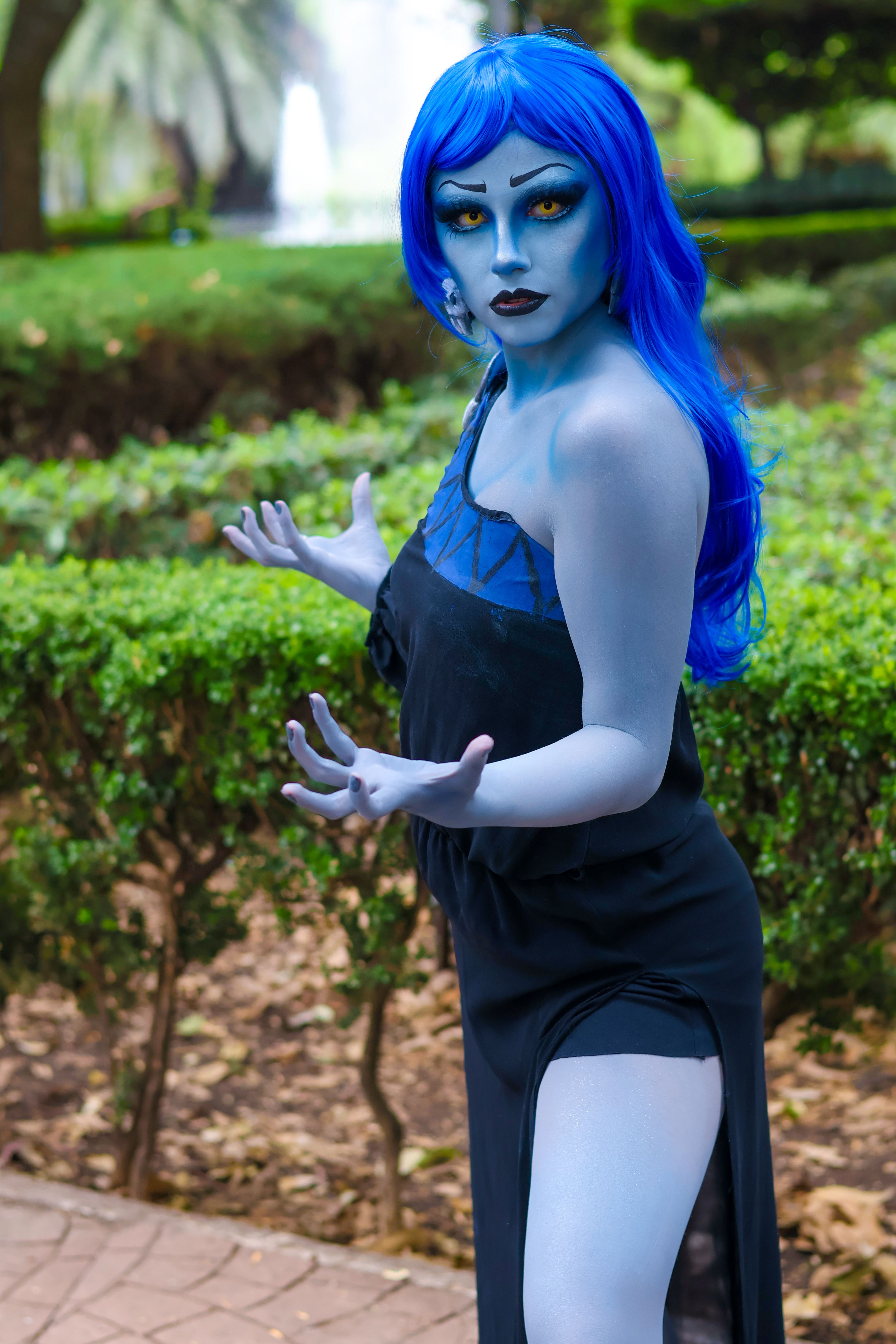 Cosplayer in Blue Makeup Posing Outdoors