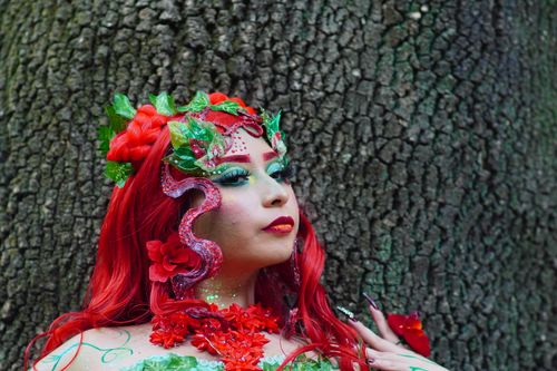 Free Colorful fantasy cosplay portrait showcasing intricate face makeup and elaborate costume. Stock Photo