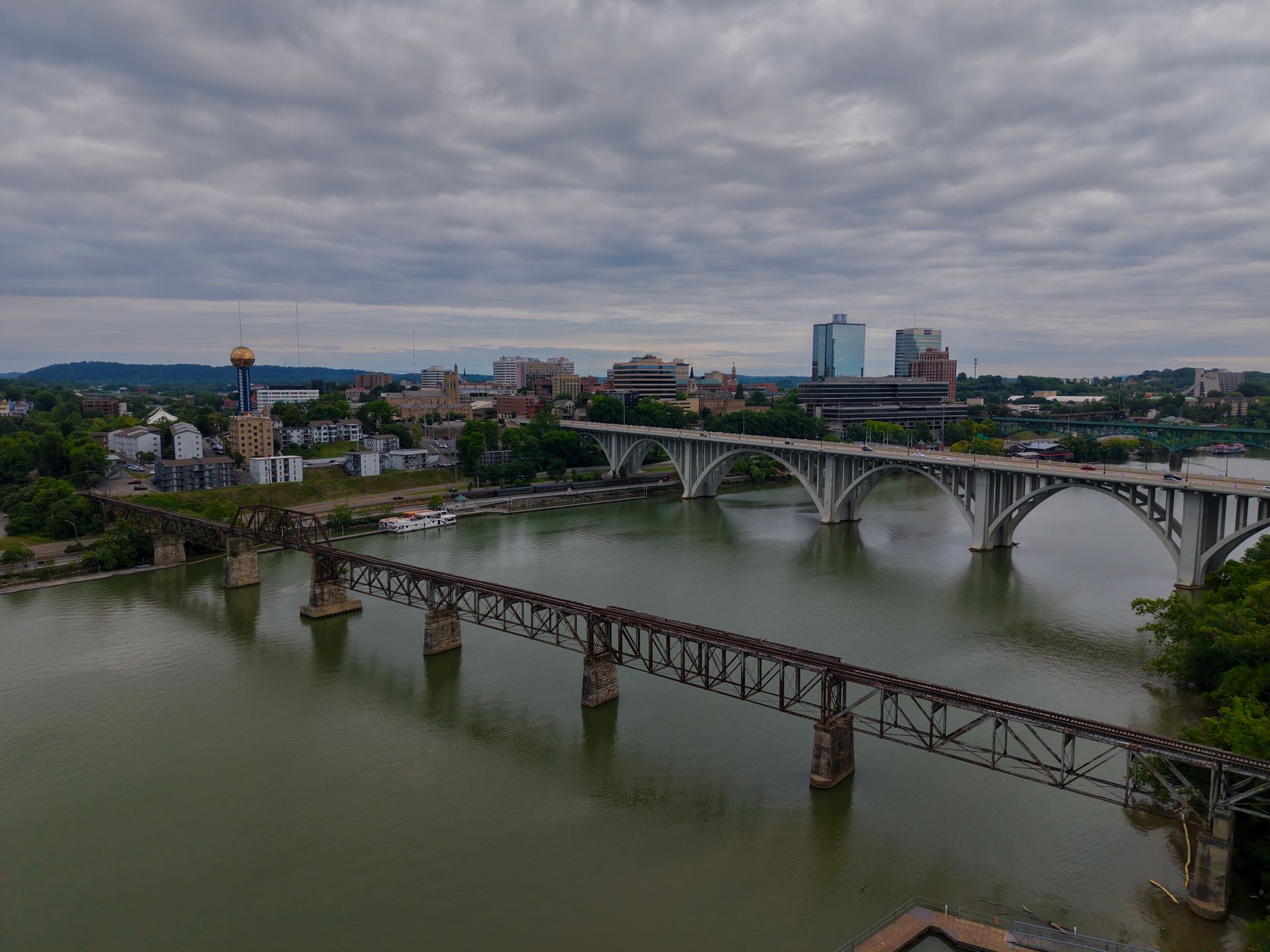 Aerial view of the Tennessee River, downtown bridges, and Knoxville skyline