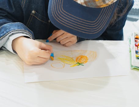 A young student engaged in a still life drawing session with crayons in a Tokyo art class.