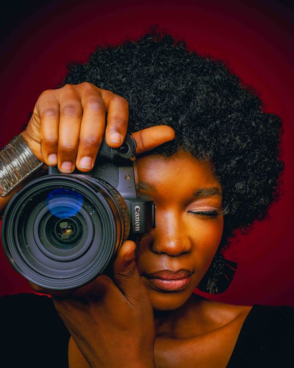 Portrait of a Photographer with Camera · Free Stock Photo