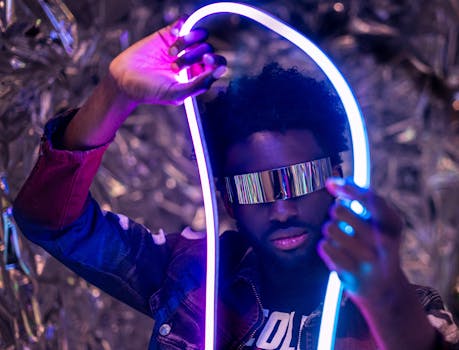 Stylish futuristic portrait showcasing neon light artistry and reflective visor.