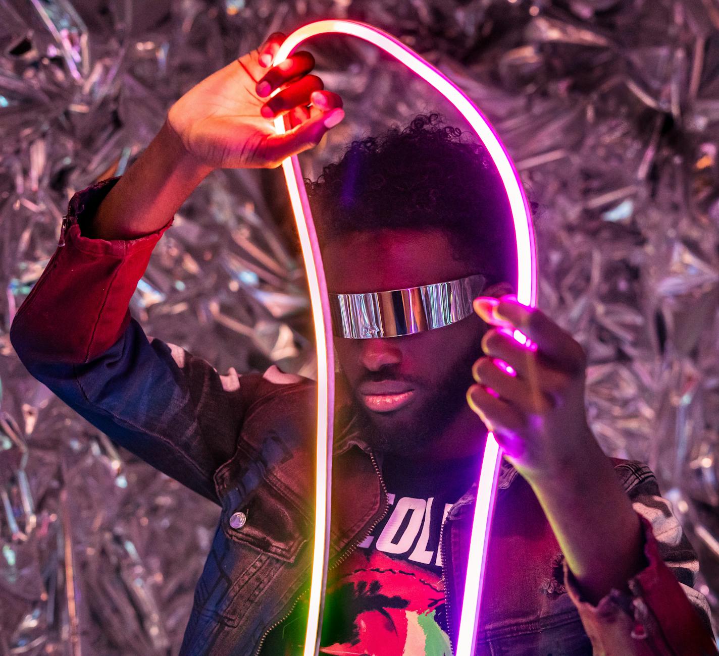 apollo group tv app image show futuristic neonn art with reflective glasses