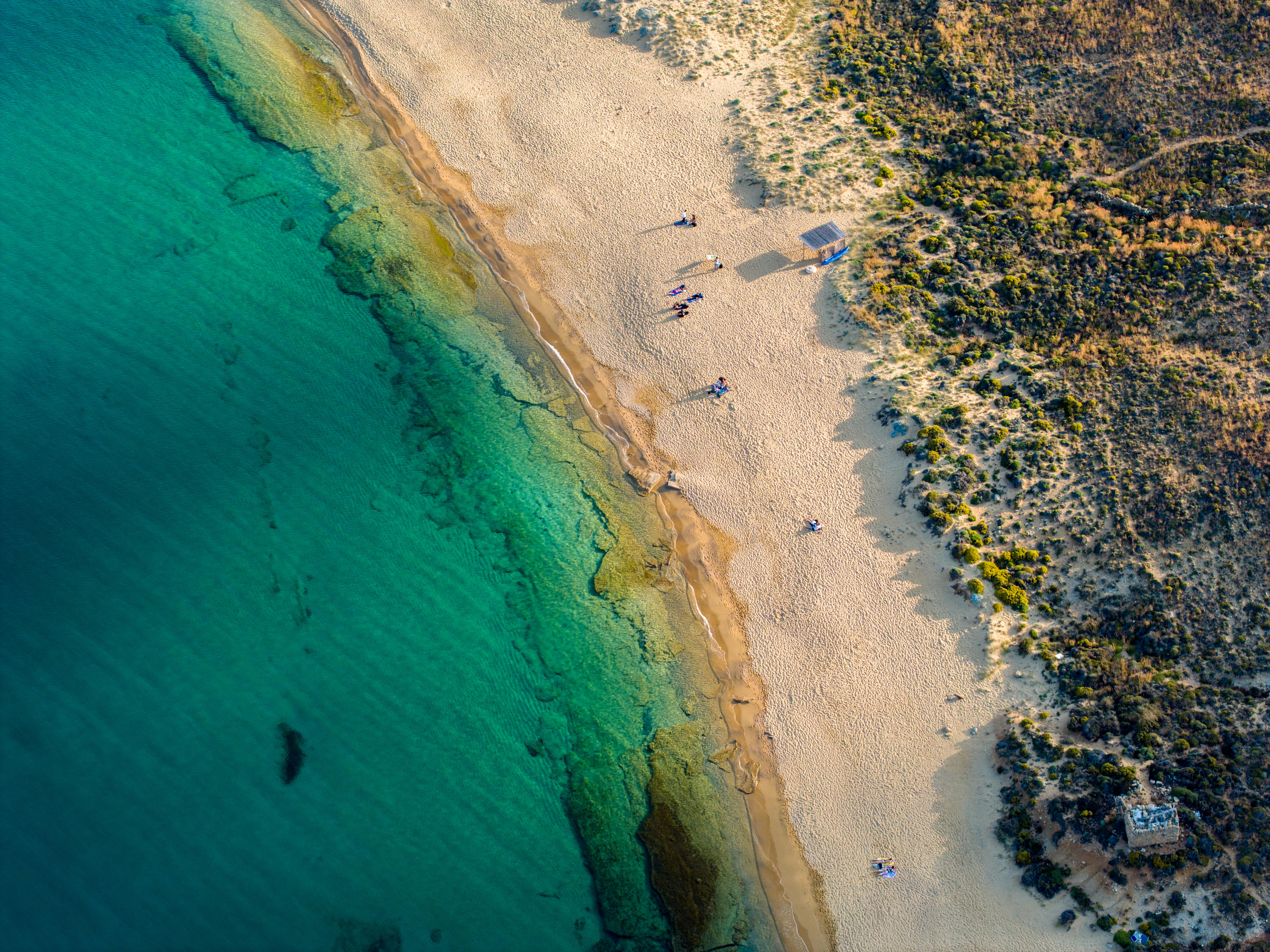 Aerial view of a pristine sandy beach in Greece
