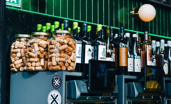 Vibrant wine bar setting in Buenos Aires showcasing bottles and corks.
