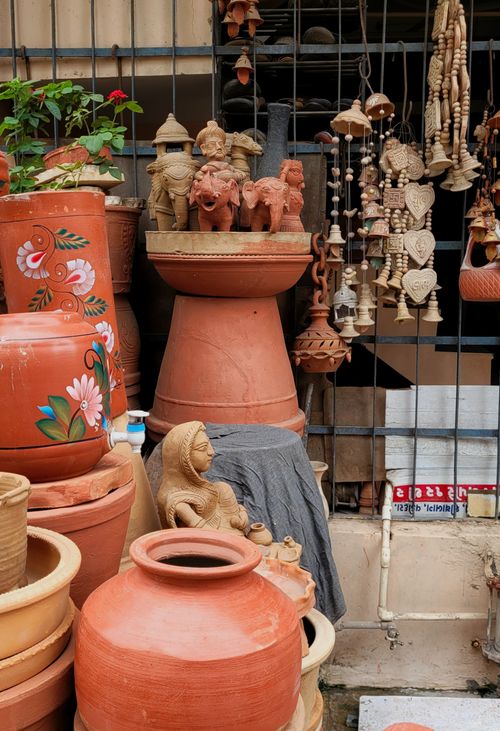Free A vibrant display of handcrafted clay pottery and sculptures in Vadodara, India. Stock Photo