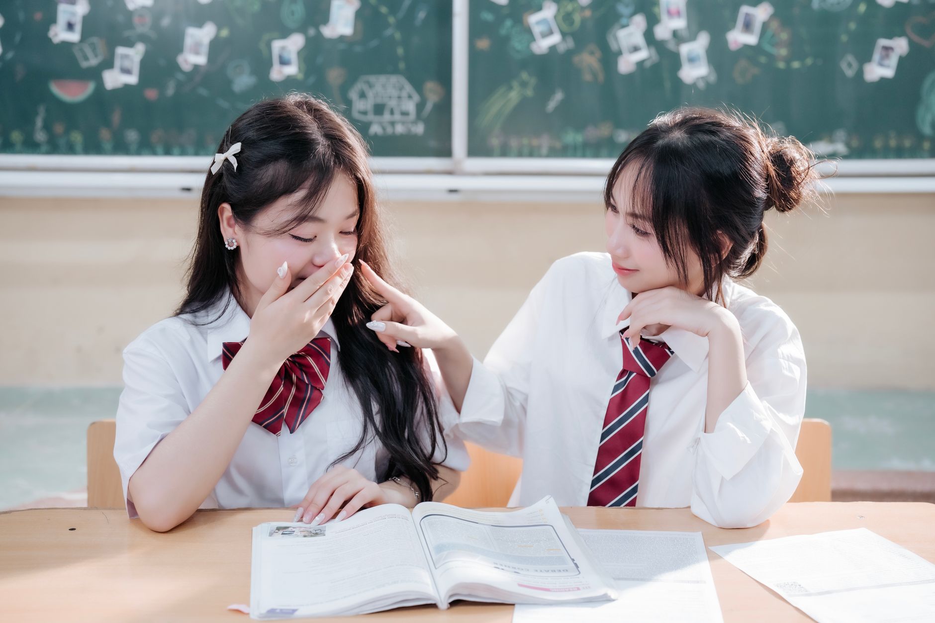 Diverse group of foreign high school students studying together in a modern Korean classroom