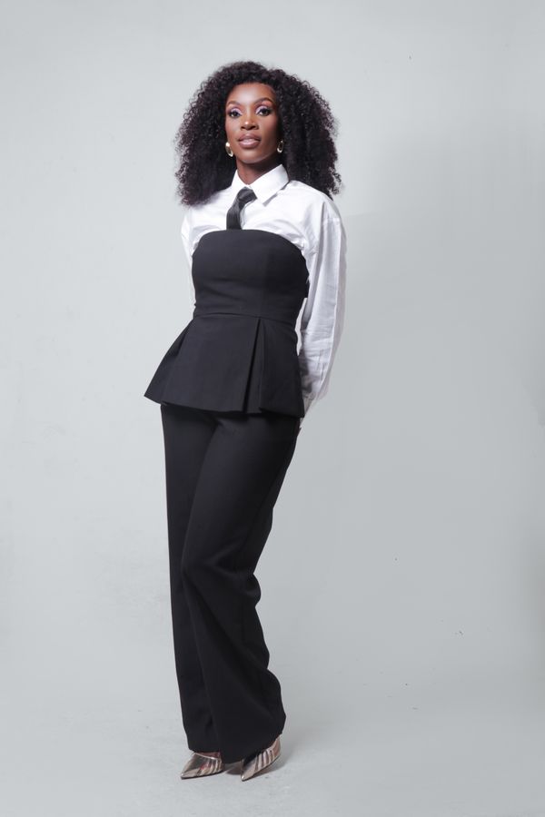 Woman wearing wide-leg trousers with a peplum top