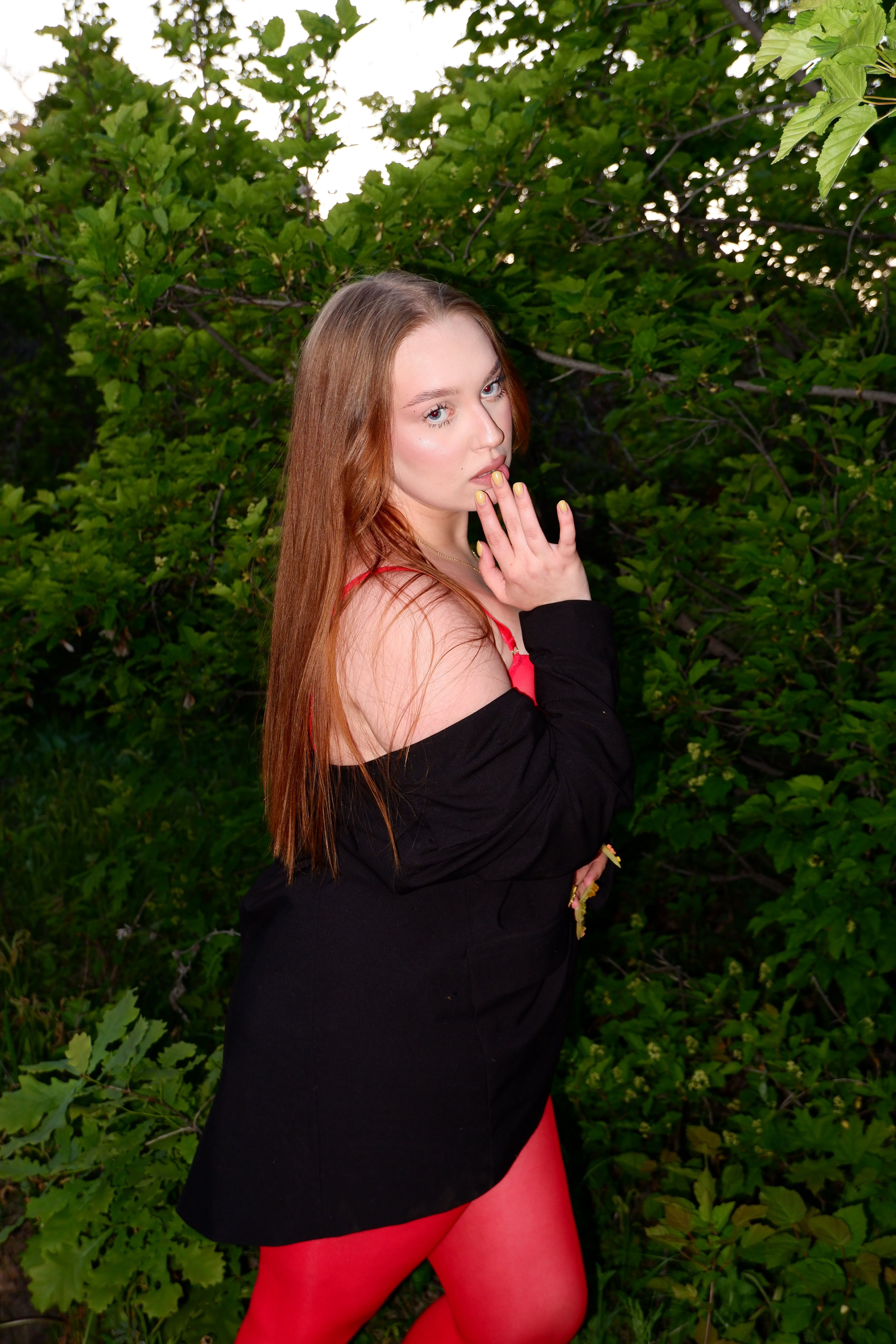 Young Woman Posing in Red Dress Outdoors · Free Stock Photo