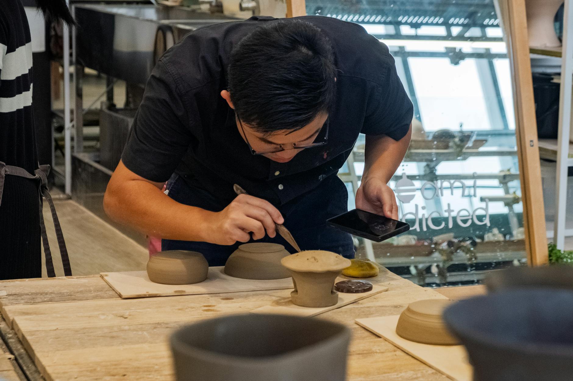 Artist hand crafting a bowl