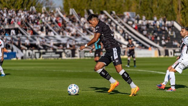 Exciting football match capturing players in action, showcasing athleticism and teamwork.
