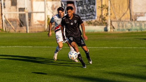 Free Two soccer players compete fiercely for the ball during a match. Stock Photo