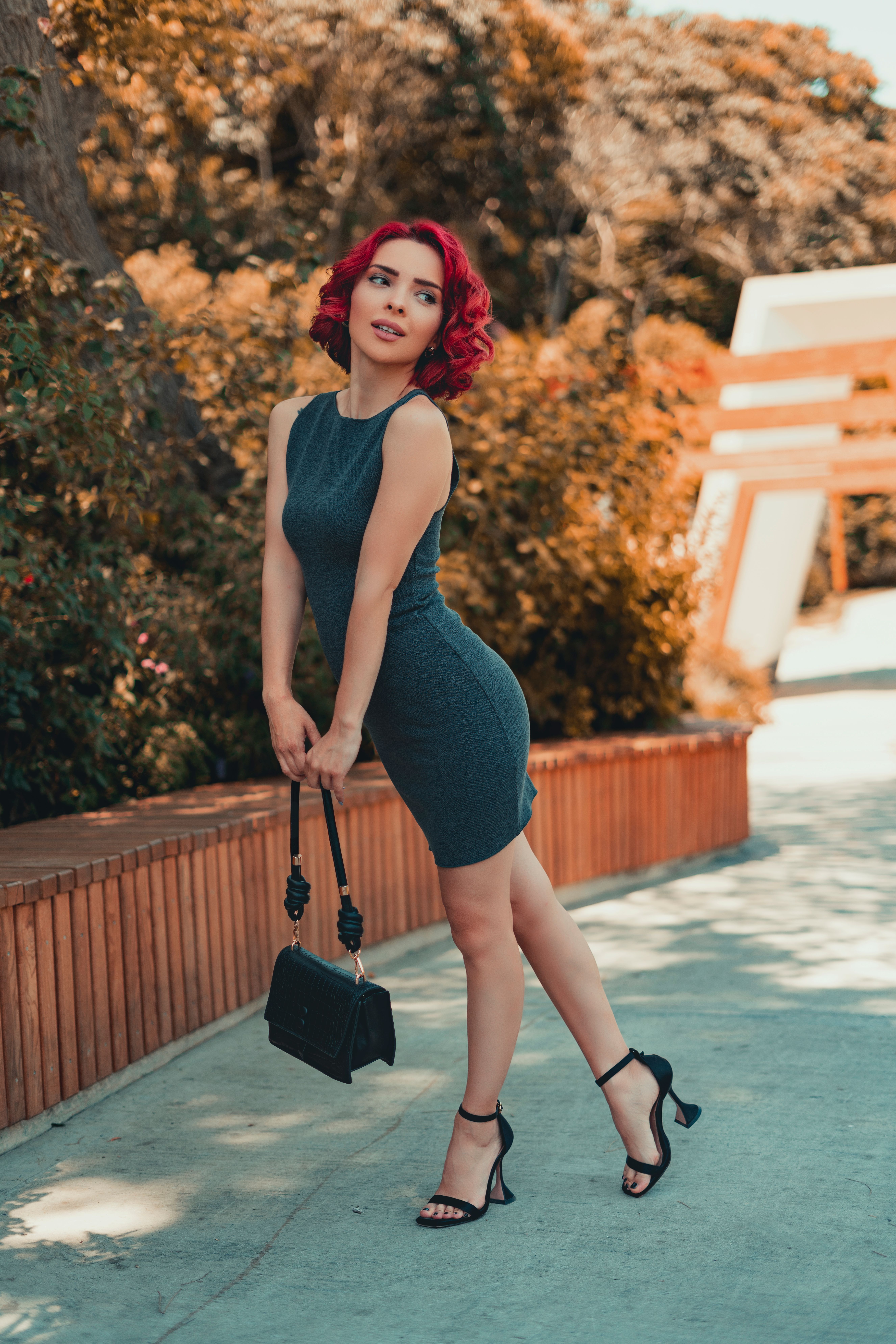Stylish Woman Posing Outdoors in Summer · Free Stock Photo