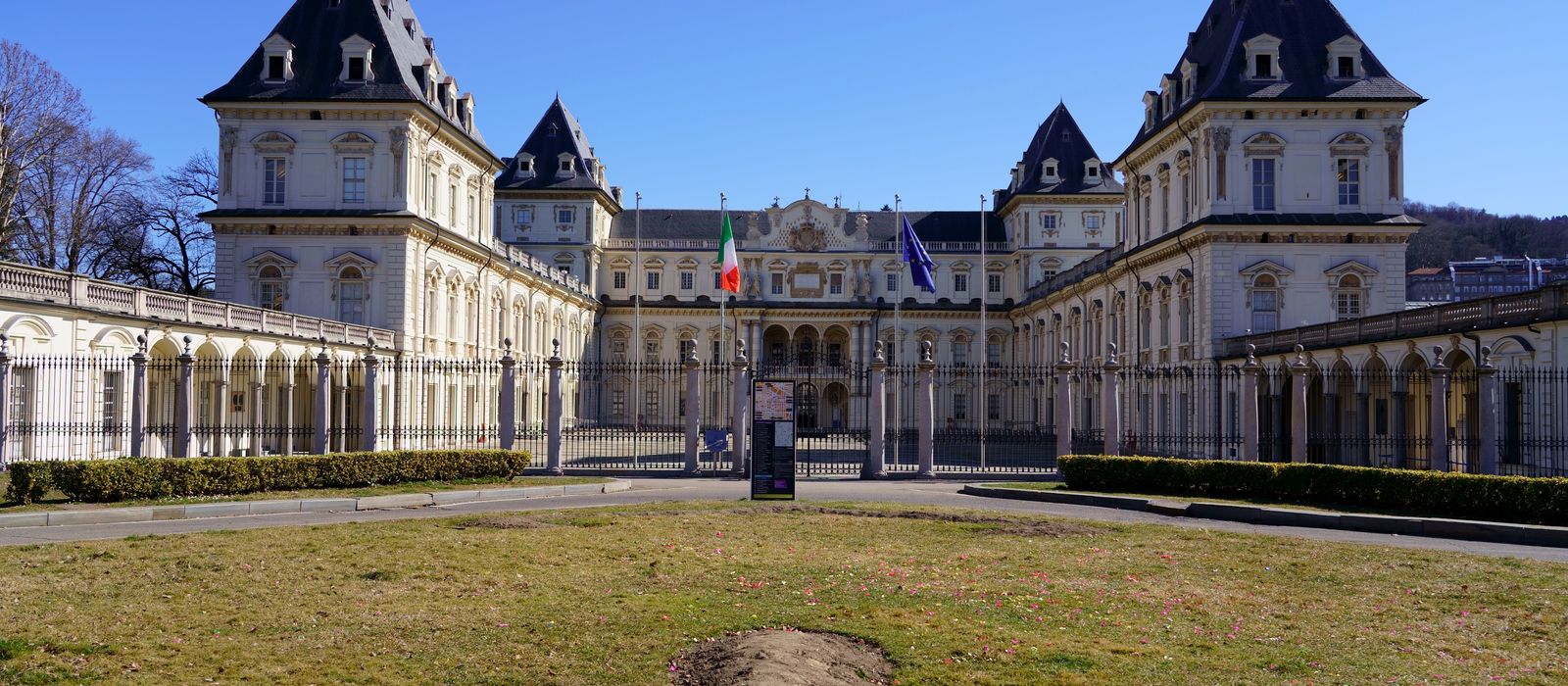 Valentino Castle in Turin showcased under clear blue skies, a prime example of historical architecture.