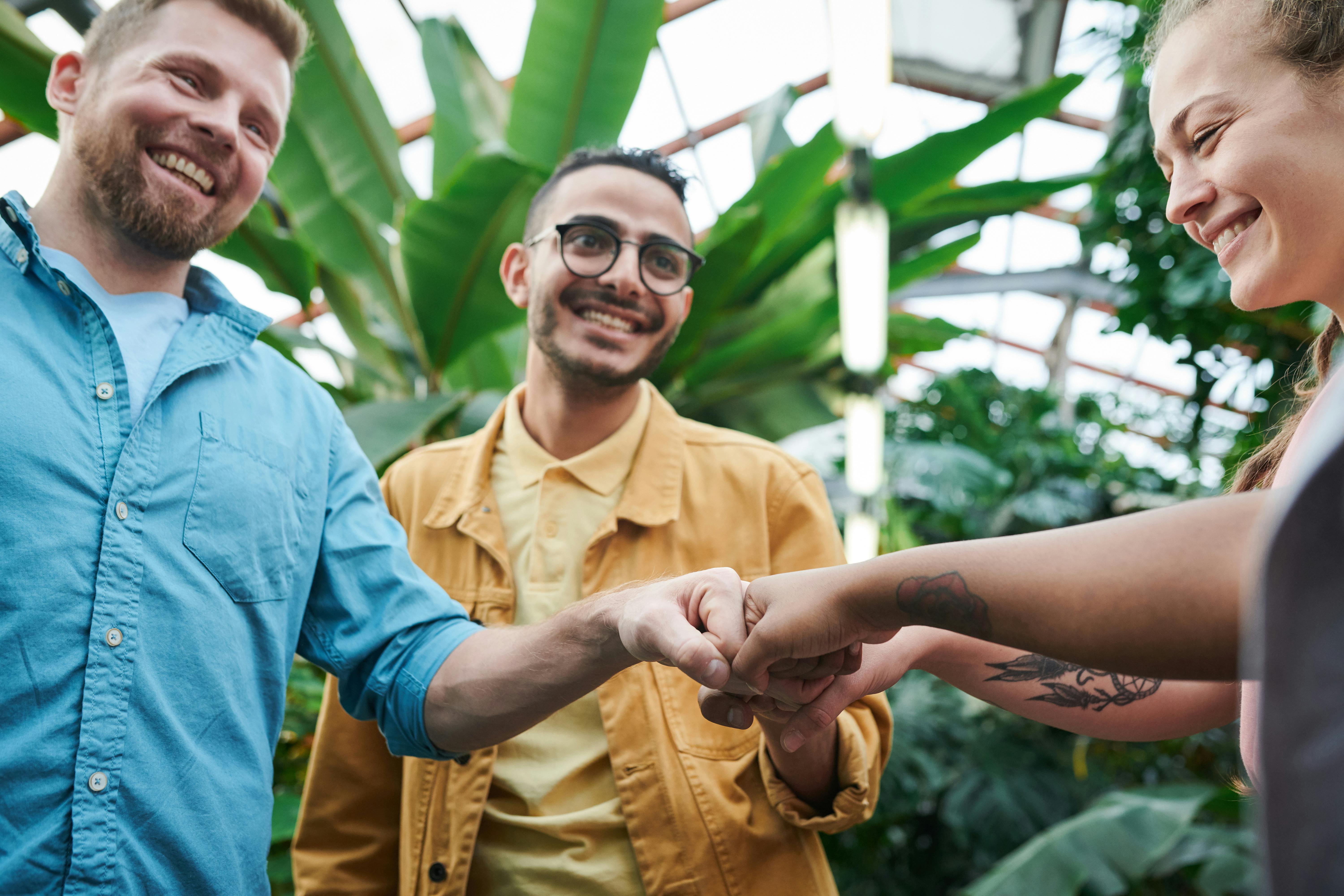 photo of people doing fist bump