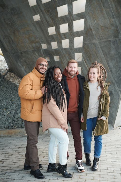 People Standing Beside Concrete Wall