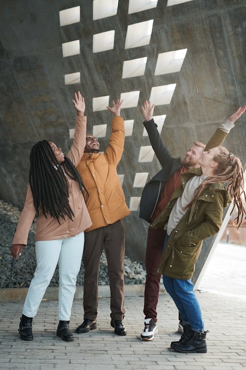 Free Photo of People Raising Their Hands Up Stock Photo