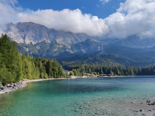 Free A stunning view of Eibsee with turquoise waters and the majestic Zugspitze mountain in Bavaria, Germany. Stock Photo