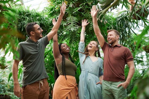 Photo of People Raising Their Hands Up