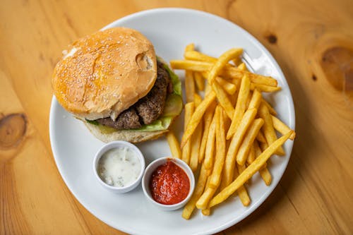 Free Top View Photo Of Burger Beside Fries Stock Photo