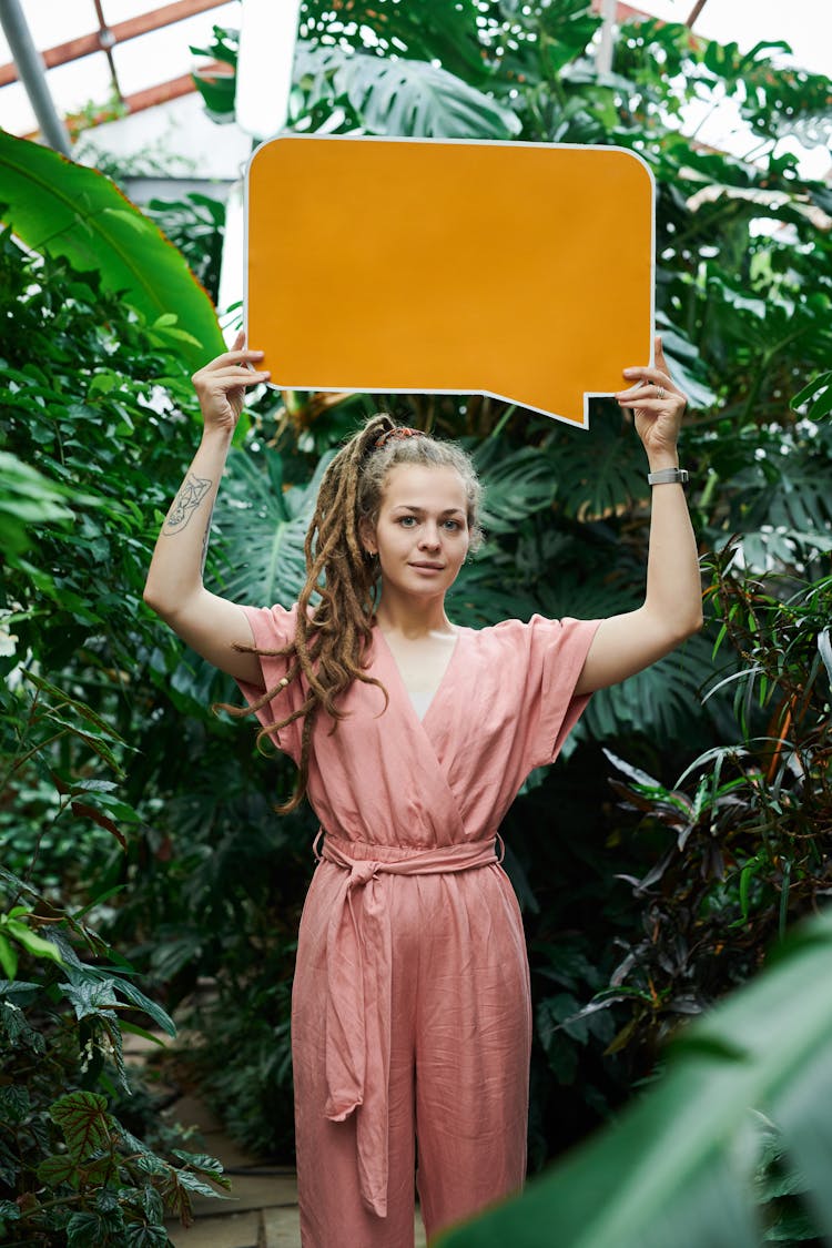 Photo Of Woman Holding Sign Board