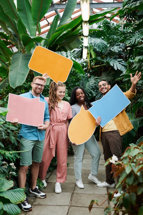 Photo of Men and Women Holding Blank Signboards