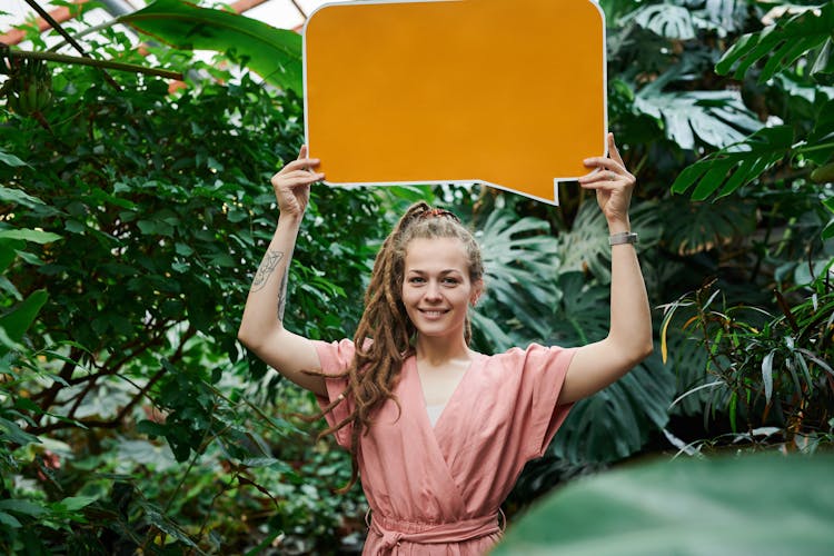 Photo Of Woman Holding Sign Board