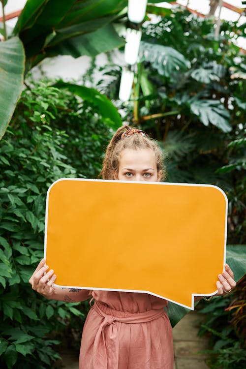 Free Photo of Woman Holding Blank Signboard Stock Photo