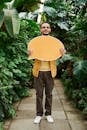 Photo Of Man Holding Yellow Message Board