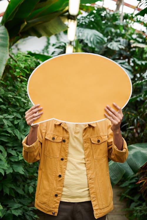 Photo Of Man Holding Signage