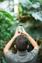Shallow Focus Photo of Man Using Smartphone