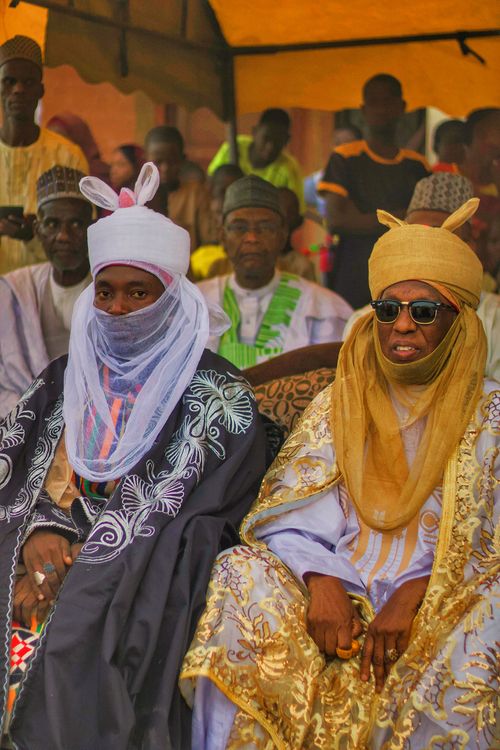 Free Men in elaborate traditional attire at an African festival showcasing rich cultural heritage. Stock Photo