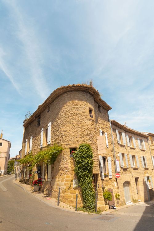 Free Idyllic street scene with traditional stone architecture in Châteauneuf-du-Pape, Provence, France. Stock Photo