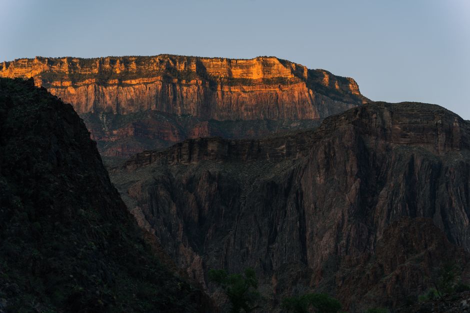 Majestic view of the Grand Canyon at sunset, capturing layered rock formations in Arizona.