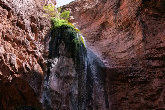The 200-foot Mooney Falls deep in the canyon below the campground