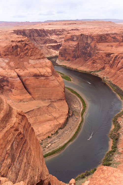 Free A breathtaking aerial shot of Horseshoe Bend in Arizona showcasing the dramatic curves of the Colorado River. Stock Photo