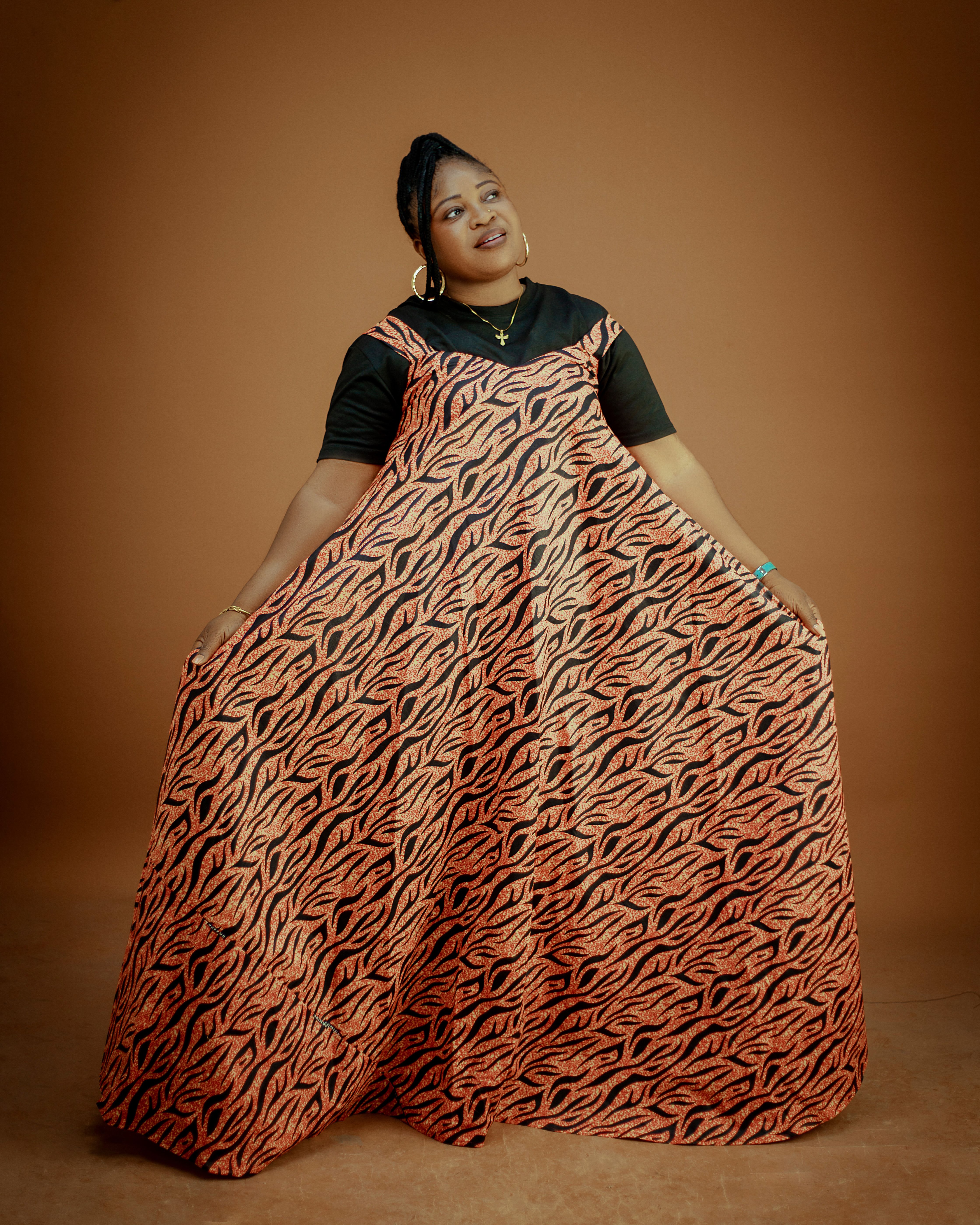 Elegant Portrait of Woman in Colorful African Dress  Free Stock Photo