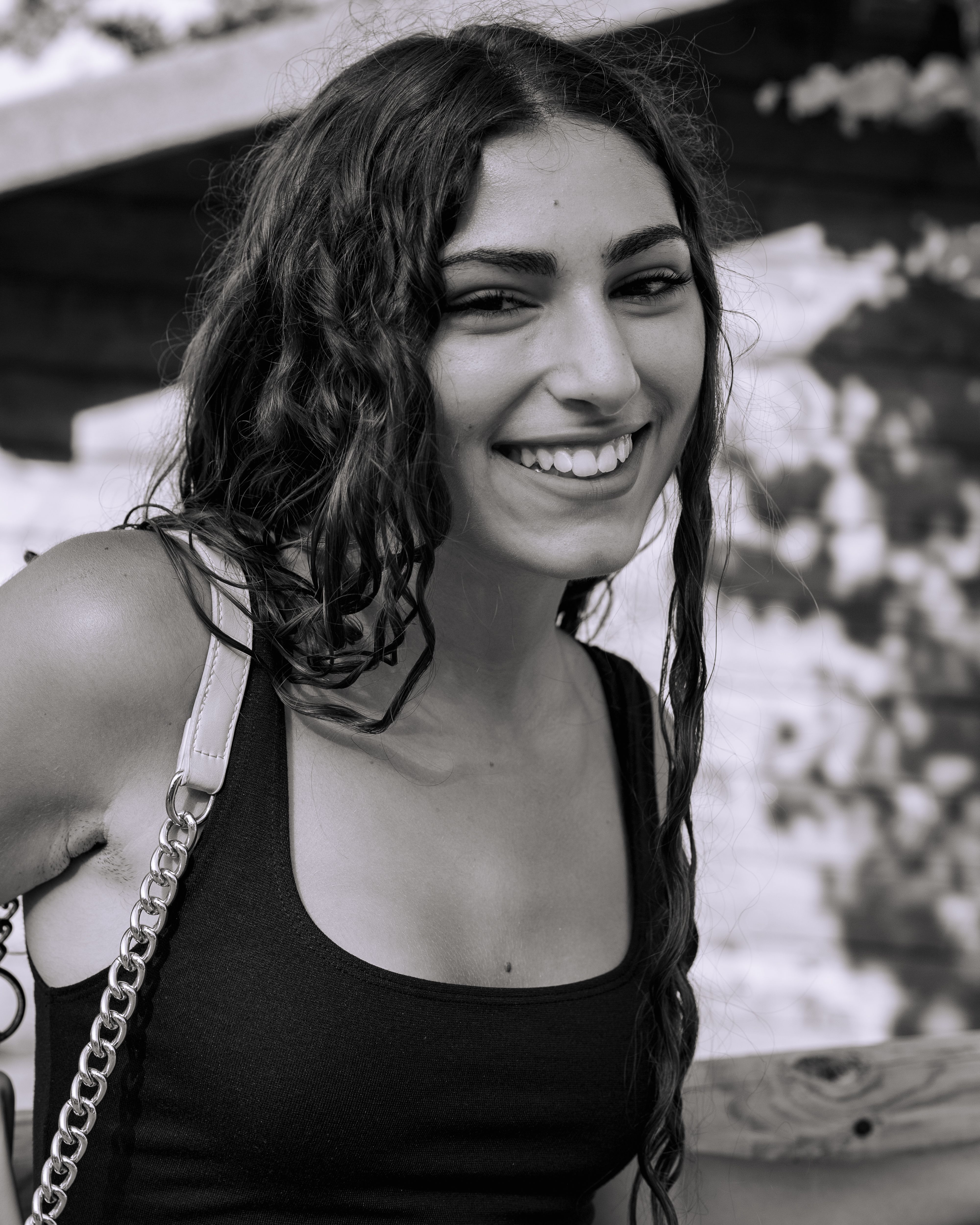 Smiling Woman in Black Dress Outdoors Portrait · Free Stock Photo